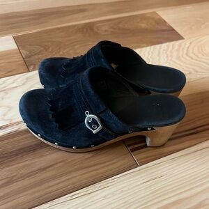 Black suede UGG clogs with wooden heel and studs